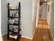 Hallway with hardwood floors and a bookcase for extra storage at 1555 California St # 610, Denver, CO 80202