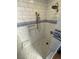 Elegant shower featuring white subway tile, mosaic details, and modern fixtures at 1555 California St # 610, Denver, CO 80202