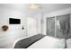 Modern bedroom with a king bed and ensuite bathroom at 2837 Vallejo St # 108, Denver, CO 80211