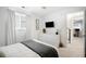 Bright bedroom featuring a comfortable bed and built-in TV at 2837 Vallejo St # 108, Denver, CO 80211