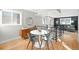 Modern dining area with round table and four chairs, near kitchen at 2837 Vallejo St # 108, Denver, CO 80211