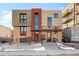 Modern condo building with brick and neutral toned siding, plus well-kept landscaping at 2837 Vallejo St # 108, Denver, CO 80211