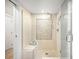 Large walk-in shower with mosaic tile and built-in seat at 2837 Vallejo St # 108, Denver, CO 80211