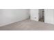 Cozy carpeted bedroom with access to ensuite bathroom at 5783 N Jericho Way, Aurora, CO 80019