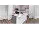Spacious modern kitchen featuring stainless steel appliances and a central island at 5783 N Jericho Way, Aurora, CO 80019
