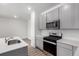 Well-lit kitchen with modern appliances and ample counter space at 5783 N Jericho Way, Aurora, CO 80019