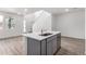 Open-concept kitchen featuring stainless steel appliances, quartz countertops, and sleek cabinetry at 5783 N Jericho Way, Aurora, CO 80019