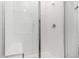 Modern tiled shower with glass door and built-in seat at 5783 N Jericho Way, Aurora, CO 80019