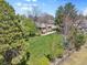Aerial view showcases the home with a manicured lawn, mature trees and a fenced perimeter at 6490 S Pontiac Ct, Centennial, CO 80111