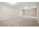 Finished basement with carpet flooring and natural light at 6490 S Pontiac Ct, Centennial, CO 80111