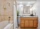 Bathroom showcasing a tub shower and granite countertops at 6490 S Pontiac Ct, Centennial, CO 80111