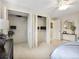 This bedroom features large closets and a ceiling fan at 6490 S Pontiac Ct, Centennial, CO 80111