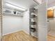 Walk-in closet with wire shelving and ample storage space next to the Laundry Room at 6490 S Pontiac Ct, Centennial, CO 80111