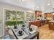 The dining area has wood floors and looks out to the backyard at 6490 S Pontiac Ct, Centennial, CO 80111