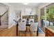The dining room is adjacent to the kitchen and features wood floors and access to the backyard at 6490 S Pontiac Ct, Centennial, CO 80111