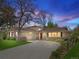 Charming single-story home showcasing manicured landscaping, stone accents, and a spacious driveway at 6490 S Pontiac Ct, Centennial, CO 80111