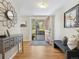 Inviting entryway featuring hardwood floors, stylish decor, and a glimpse of the home's exterior at 6490 S Pontiac Ct, Centennial, CO 80111