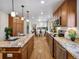 This spacious kitchen offers stainless steel appliances, granite countertops, and leads into the dining area at 6490 S Pontiac Ct, Centennial, CO 80111