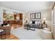Cozy living area that features hardwood floors, neutral paint, and an open floor plan at 6490 S Pontiac Ct, Centennial, CO 80111