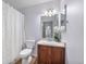 Clean bathroom with shower/tub combo and wood vanity at 1143 Autumn Star Pt, Monument, CO 80132