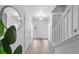 Bright and airy entryway with hardwood floors and staircase at 1143 Autumn Star Pt, Monument, CO 80132