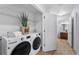 Laundry closet with washer, dryer, and shelving at 1143 Autumn Star Pt, Monument, CO 80132