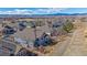 Aerial view of the home displaying the back patio, landscaping, and surrounding neighborhood at 12957 W 78Th Cir, Arvada, CO 80005