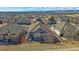 Aerial view of the home showcasing its backyard patio and landscaping, plus surrounding neighborhood at 12957 W 78Th Cir, Arvada, CO 80005