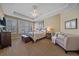 Serene main bedroom with tray ceiling, providing a peaceful retreat at 12957 W 78Th Cir, Arvada, CO 80005