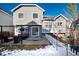 Gray house exterior with backyard patio and white fence at 11037 Pheasant Ct, Parker, CO 80134