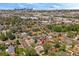 Aerial view of a home, neighborhood, and city skyline, showing its location and setting at 716 S Osage St, Denver, CO 80223