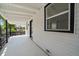 Covered back porch with white siding and black trim, perfect for outdoor relaxation at 716 S Osage St, Denver, CO 80223