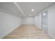 Spacious finished basement with wood-look flooring and recessed lighting, offering versatility and style at 716 S Osage St, Denver, CO 80223