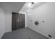 Unfinished basement area with laundry hookups, closet space, and a small window for natural light at 716 S Osage St, Denver, CO 80223