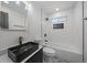 Modern bathroom showcasing stylish vanity, sleek fixtures, and a well-designed shower and bathtub area at 716 S Osage St, Denver, CO 80223