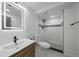 Modern bathroom featuring decorative tile in the shower, sleek vanity, and stylish finishes at 716 S Osage St, Denver, CO 80223