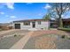 Charming single-story home features a well-maintained exterior with a landscaped front yard and an attached garage at 716 S Osage St, Denver, CO 80223