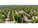 Neighborhood aerial view with tree-lined streets and well-maintained homes in a suburban setting at 7742 W Florida Dr, Lakewood, CO 80232