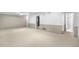 Spacious basement area with wall paneling and carpeting at 7742 W Florida Dr, Lakewood, CO 80232