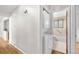 Hallway to bathroom with washer and dryer at 7742 W Florida Dr, Lakewood, CO 80232