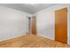 Neutral bedroom has wood floors and neutral walls at 7742 W Florida Dr, Lakewood, CO 80232
