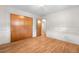 A spacious bedroom with hardwood floors, ample closet space, and neutral decor at 7742 W Florida Dr, Lakewood, CO 80232