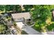 Charming ranch-style home with a two-car garage, well-maintained lawn, and mature landscaping at 7742 W Florida Dr, Lakewood, CO 80232