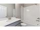 Well-lit bathroom featuring a single sink vanity with a modern faucet and a shower-tub combination at 16840 Mckay Dr, Mead, CO 80542