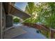 The spacious backyard deck offers shade with an awning and provides access to the pool at 2587 S Flanders Ct, Aurora, CO 80013