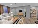 Basement Gathering room with wood floors and comfortable seating arrangement at 2587 S Flanders Ct, Aurora, CO 80013