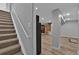 Stairs to the basement with carpet, leading to a finished living space with wood flooring at 2587 S Flanders Ct, Aurora, CO 80013
