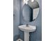 Powder bathroom with pedestal sink and updated fixture at 2587 S Flanders Ct, Aurora, CO 80013