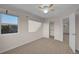 Bedroom showcasing plush carpet and an open closet with an adjacent doorway at 2587 S Flanders Ct, Aurora, CO 80013