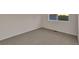 Bedroom featuring neutral walls, neutral carpet and a window for natural light at 2587 S Flanders Ct, Aurora, CO 80013